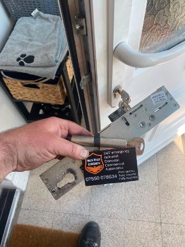 North Wales Locksmith repairing a uPVC door lock in Bangor area